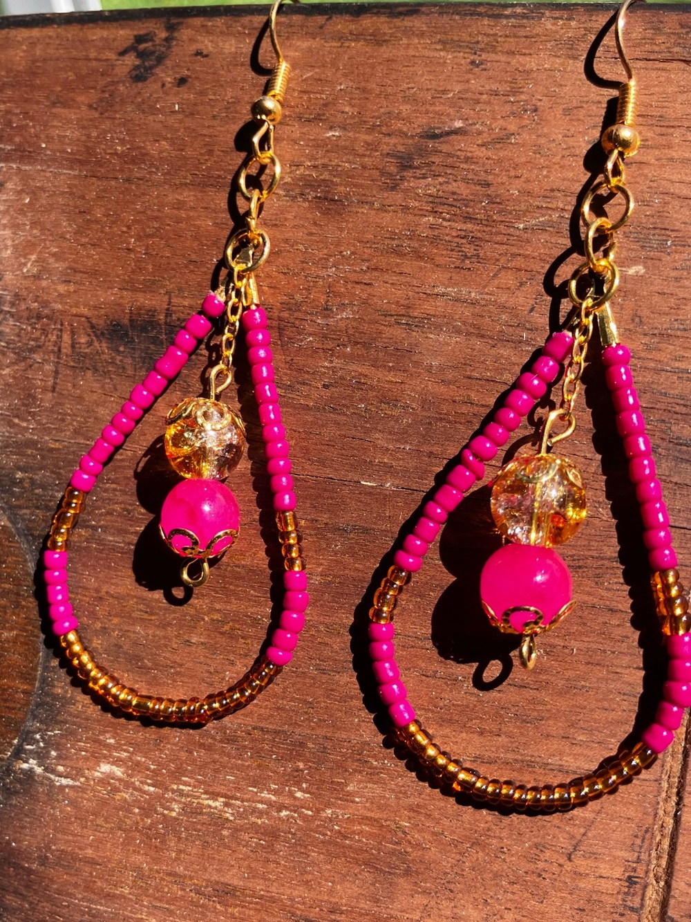 Bright pink and gold beaded teardrop earrings